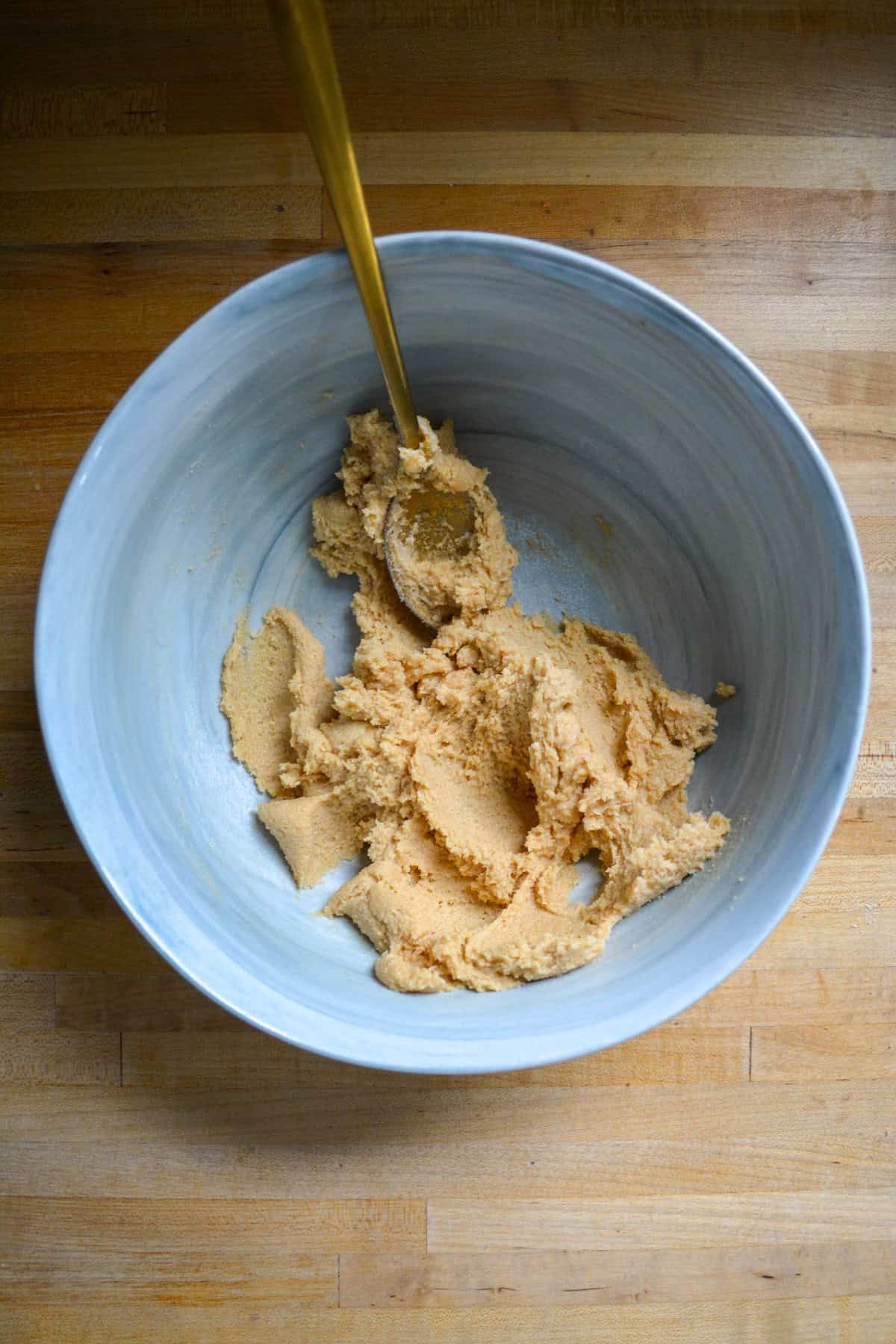 Vegan butter and brown sugar creamed together in a large bowl.