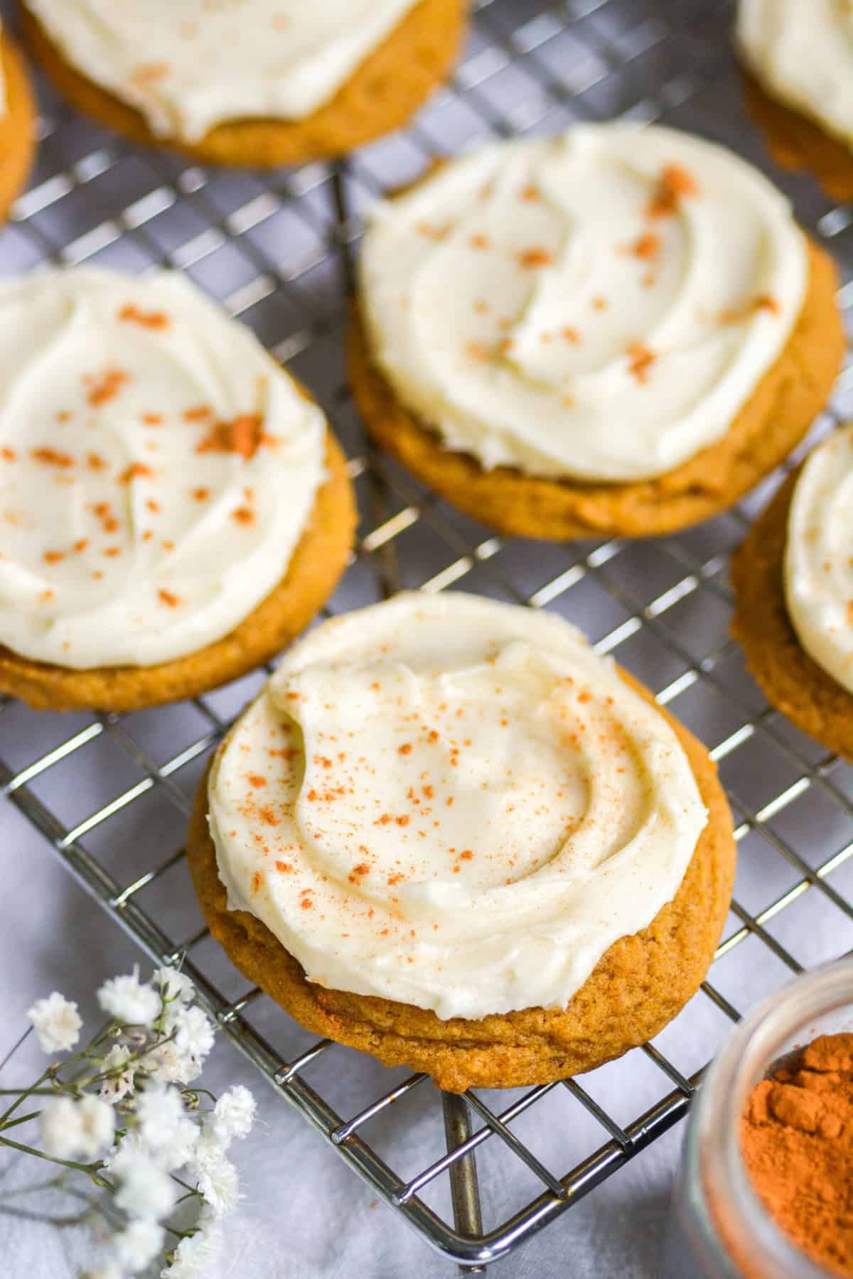 Vegan Iced Pumpkin Cookies on a wire cooling rack.