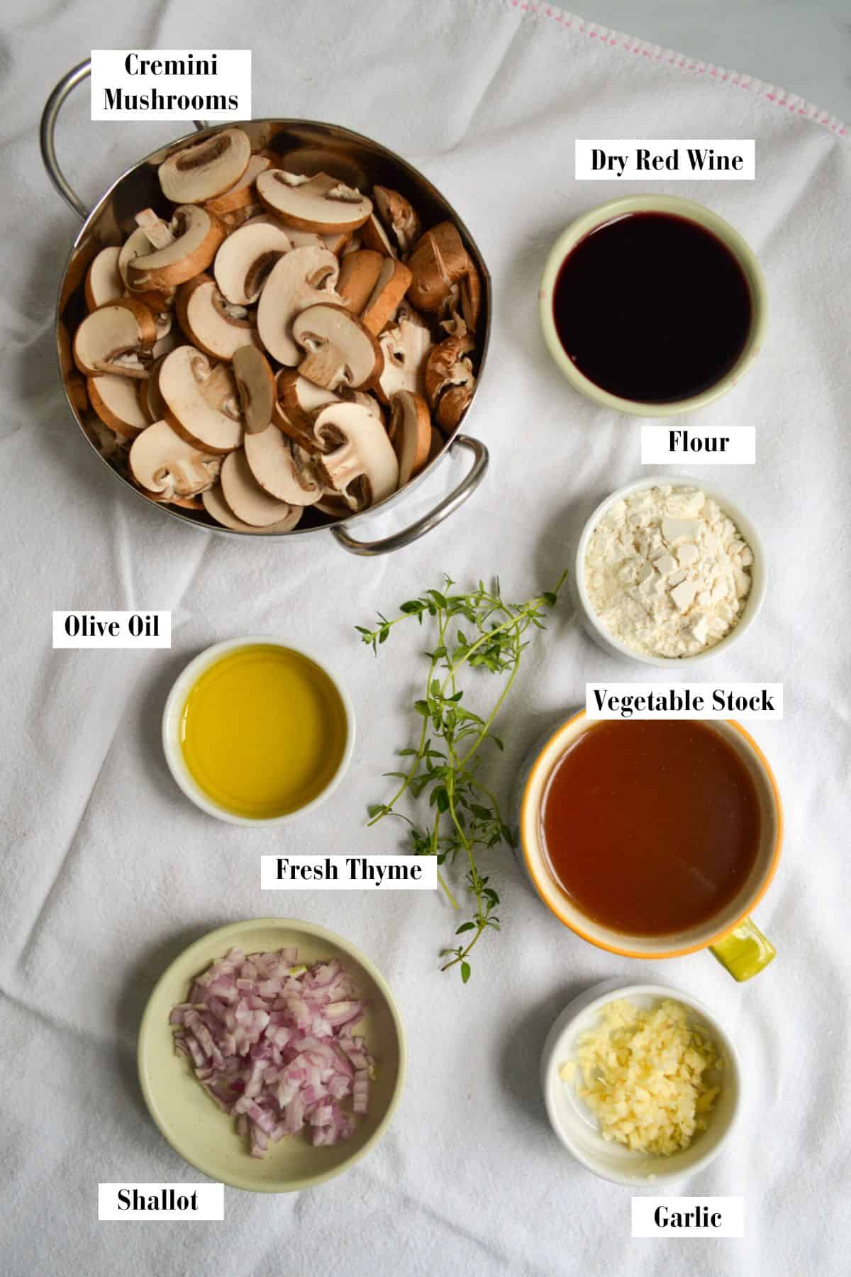 Ingredients for this recipe in small bowls on a linen cloth.