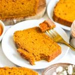 Vegan pumpkin bread on a plate with a fork.