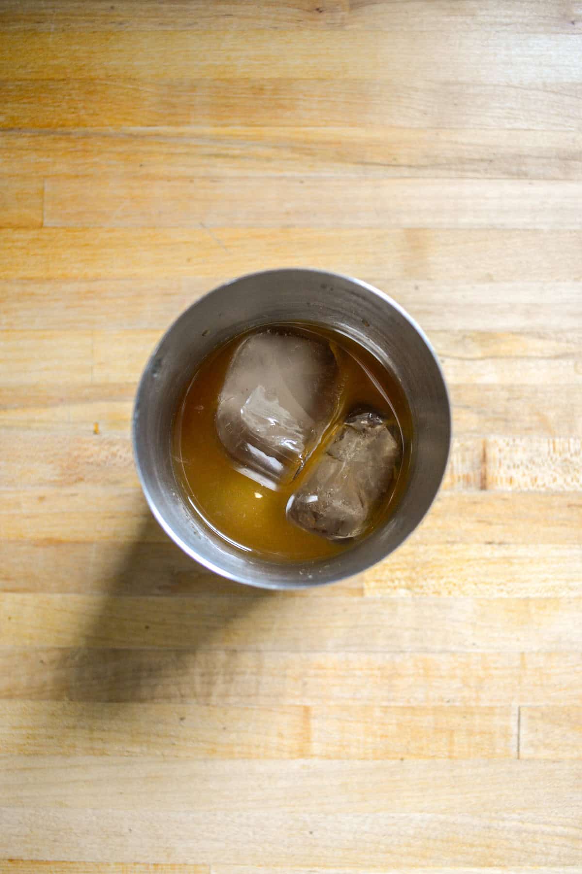 Ingredients for the cocktail in a shaker.