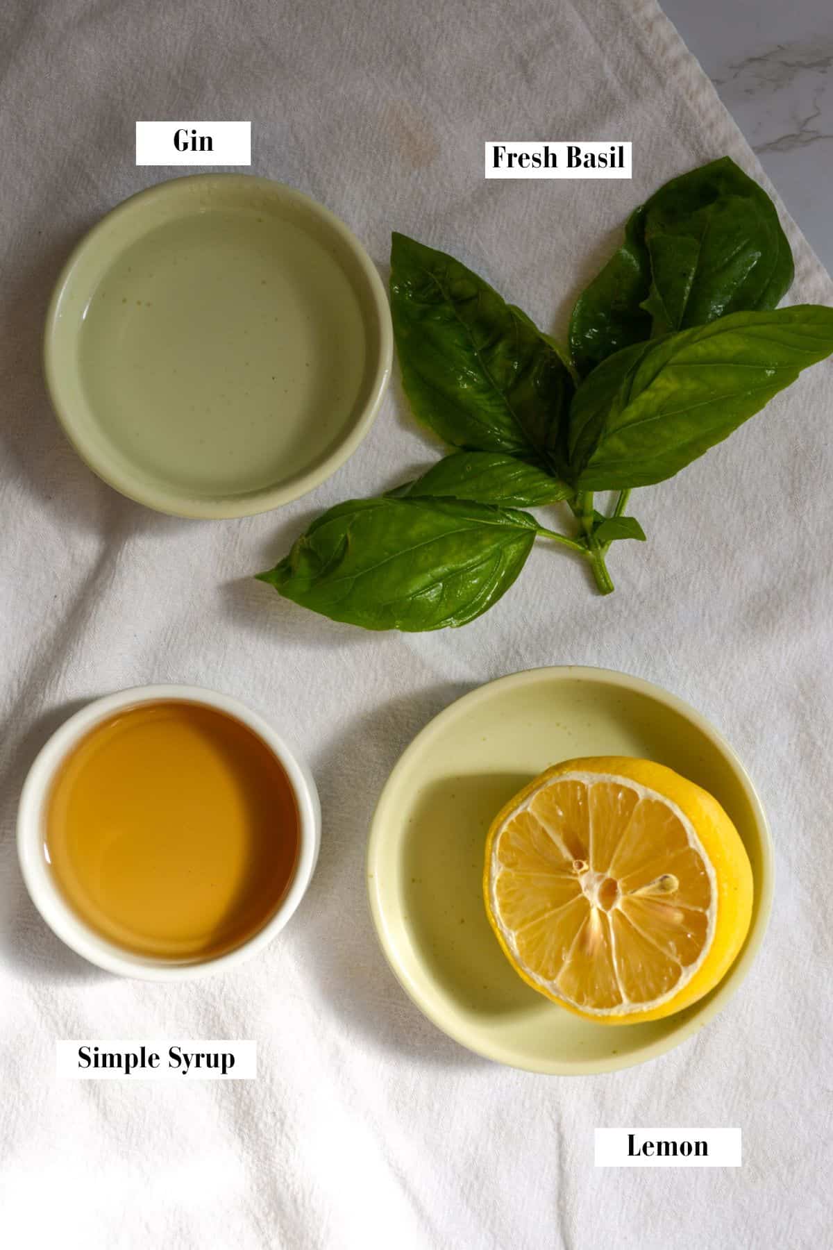 Ingredients for making this recipe in small bowls on a linen cloth.