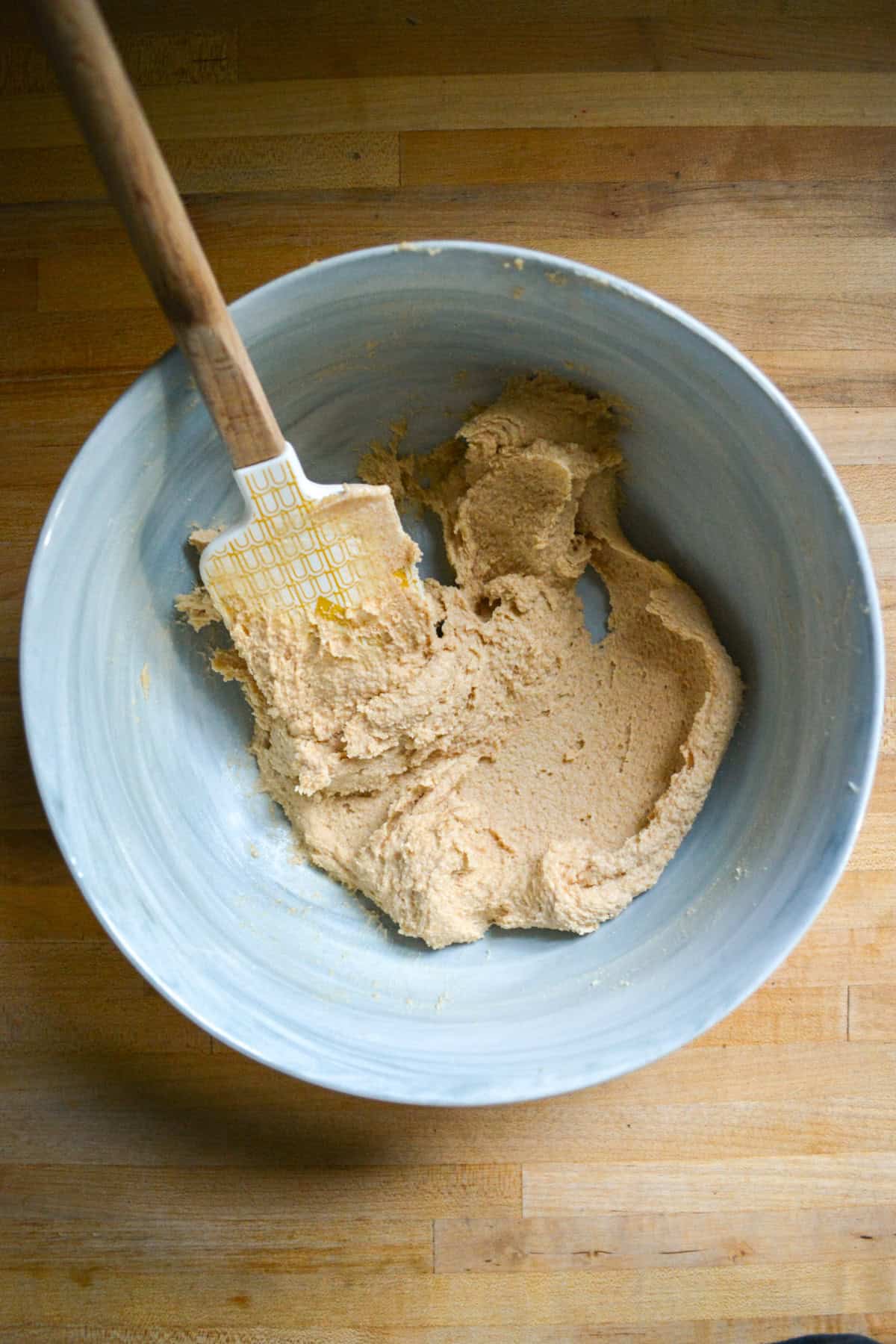 Vegan Butter and brown sugar creamed together in a large bowl.