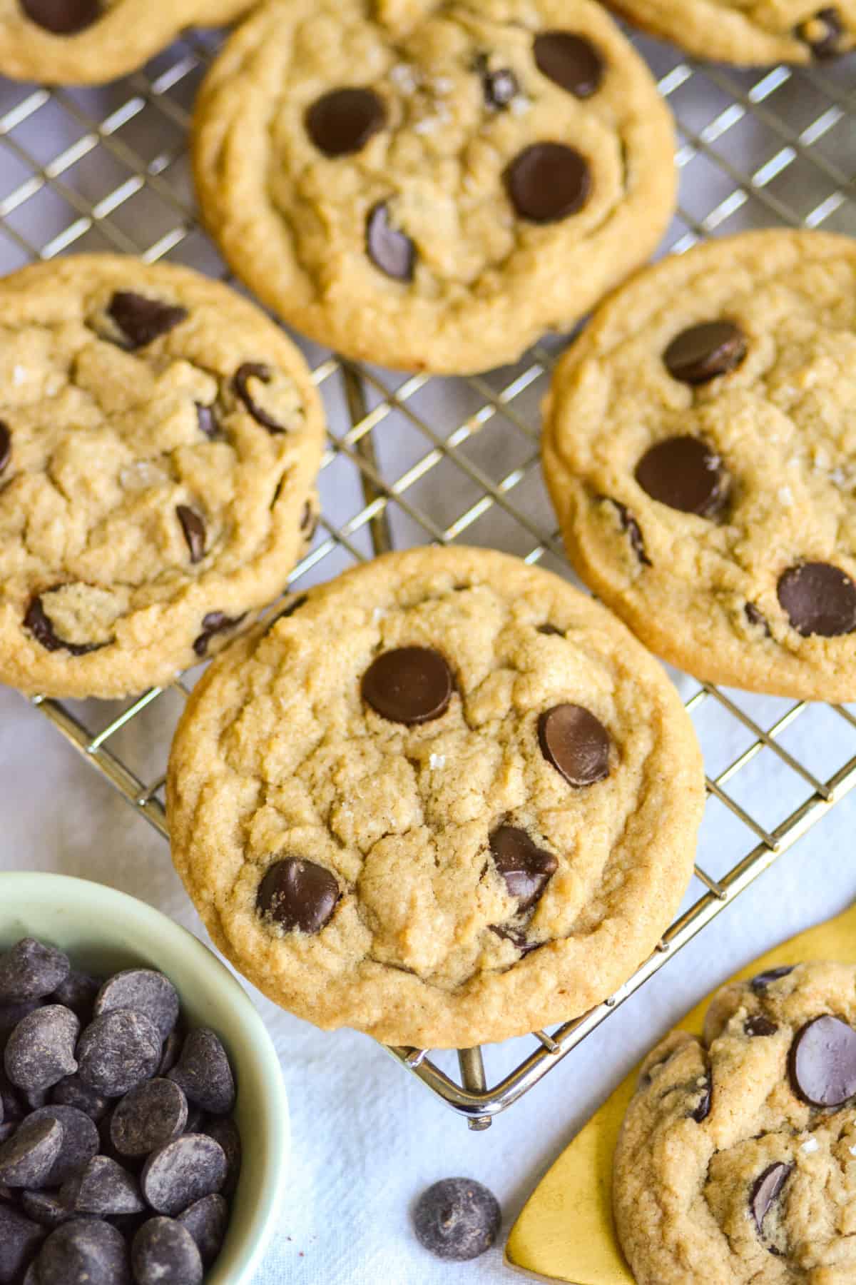 Gluten Free Vegan Chocolate Chip Cookies on a wire cooling rack.