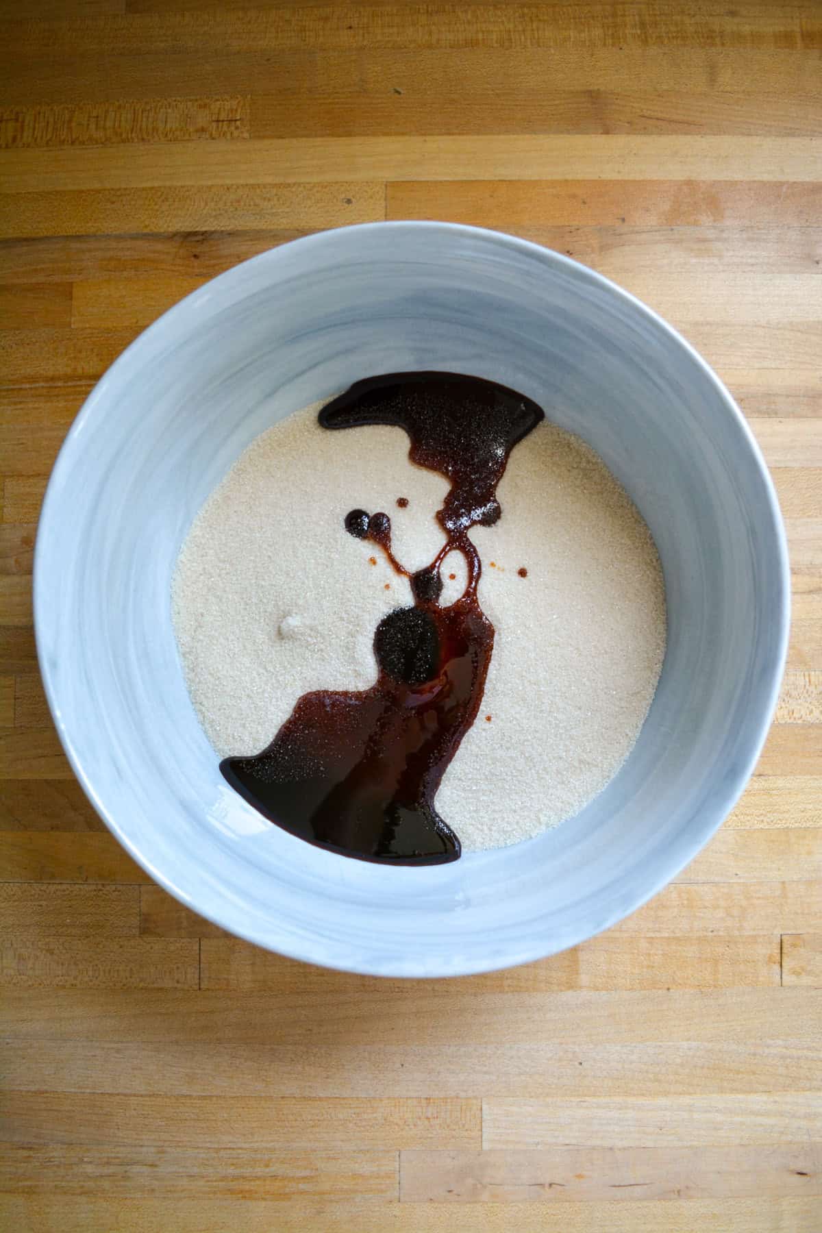 White sugar and molasses in a large mixing bowl.
