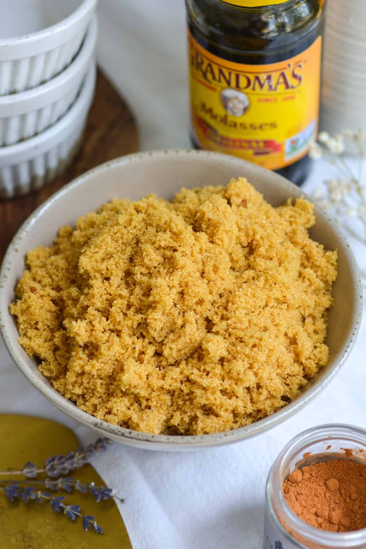 Homemade Brown Sugar in a bowl on a linen cloth.