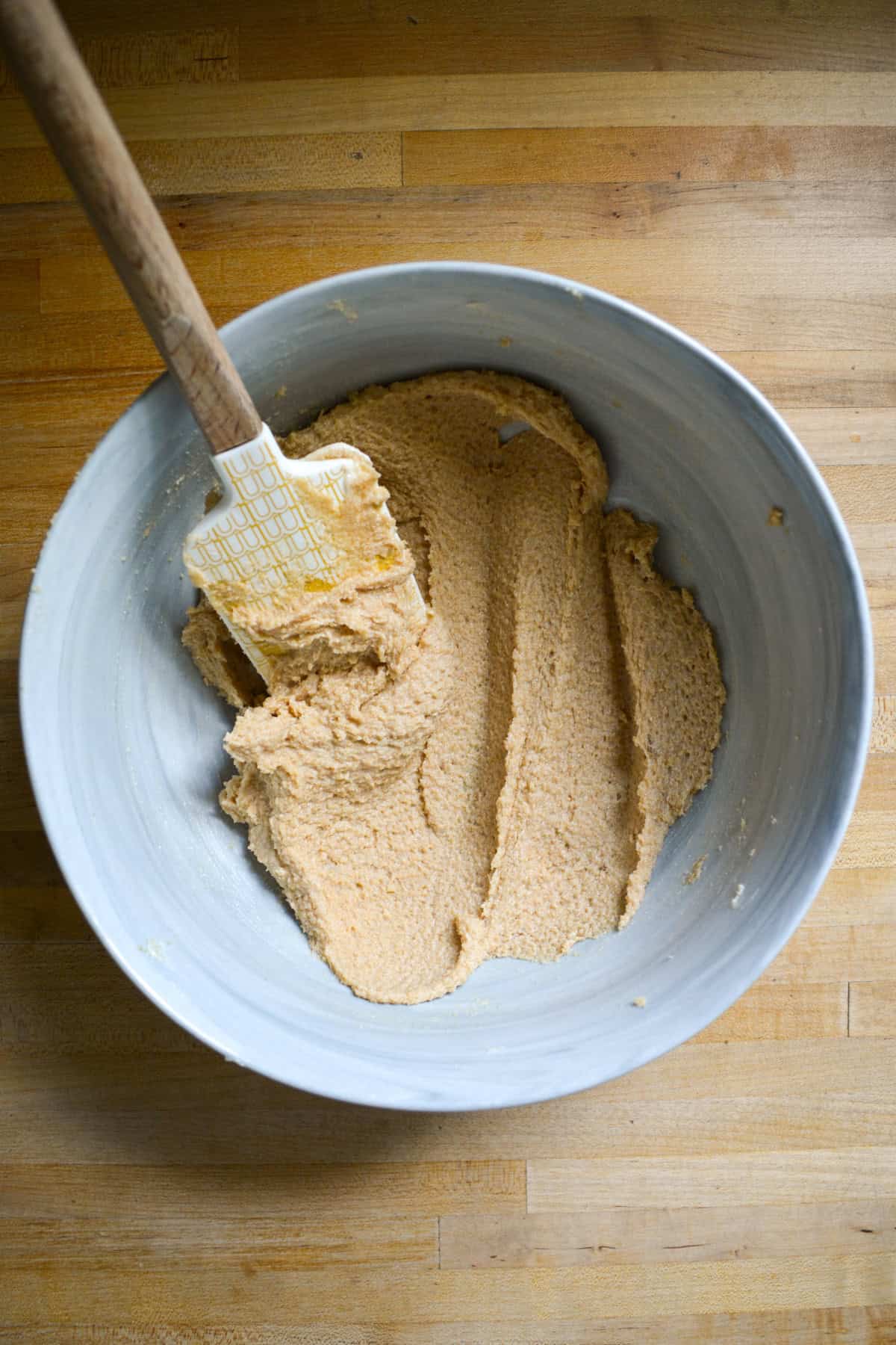 Vegan butter and brown sugar creamed together in a large mixing bowl.