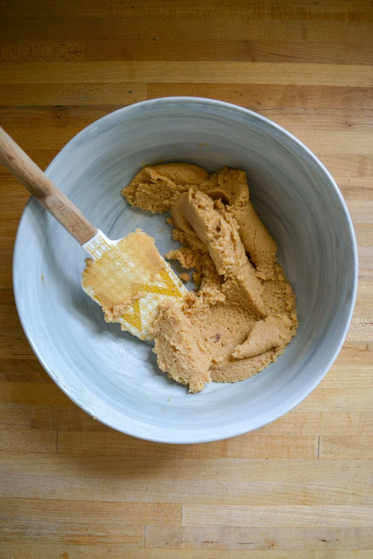 Butter and brown sugar creamed together in a large mixing bowl.