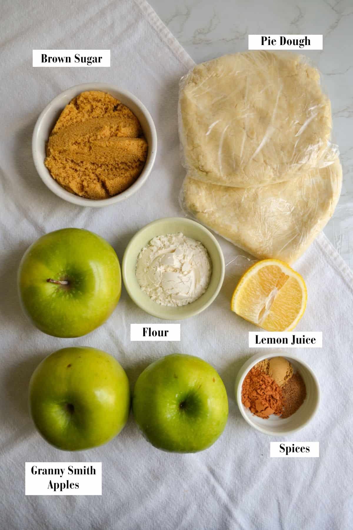 Ingredients for making this recipe in small bowls on a linen cloth.