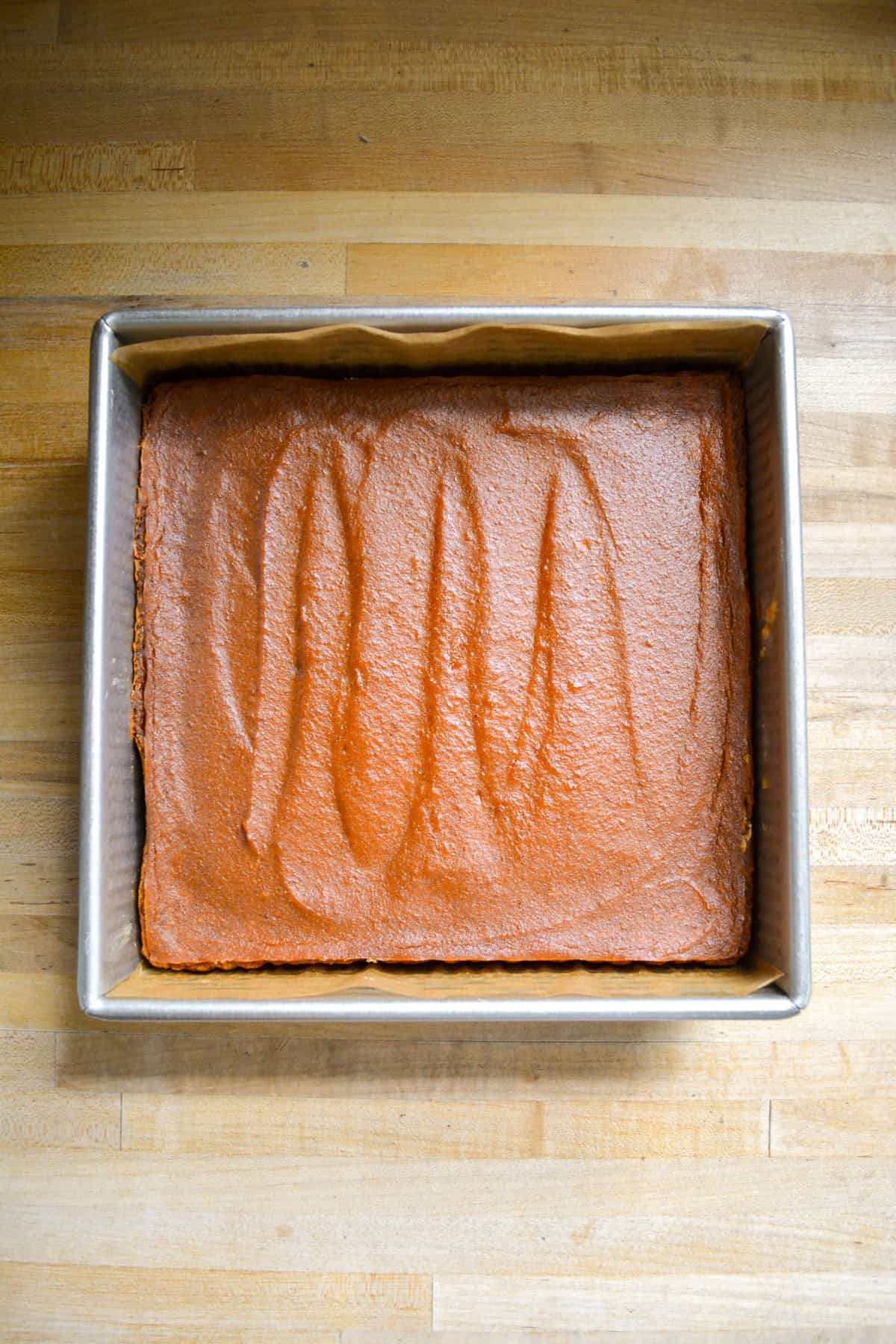 Baked vegan pumpkin bars in a pan.