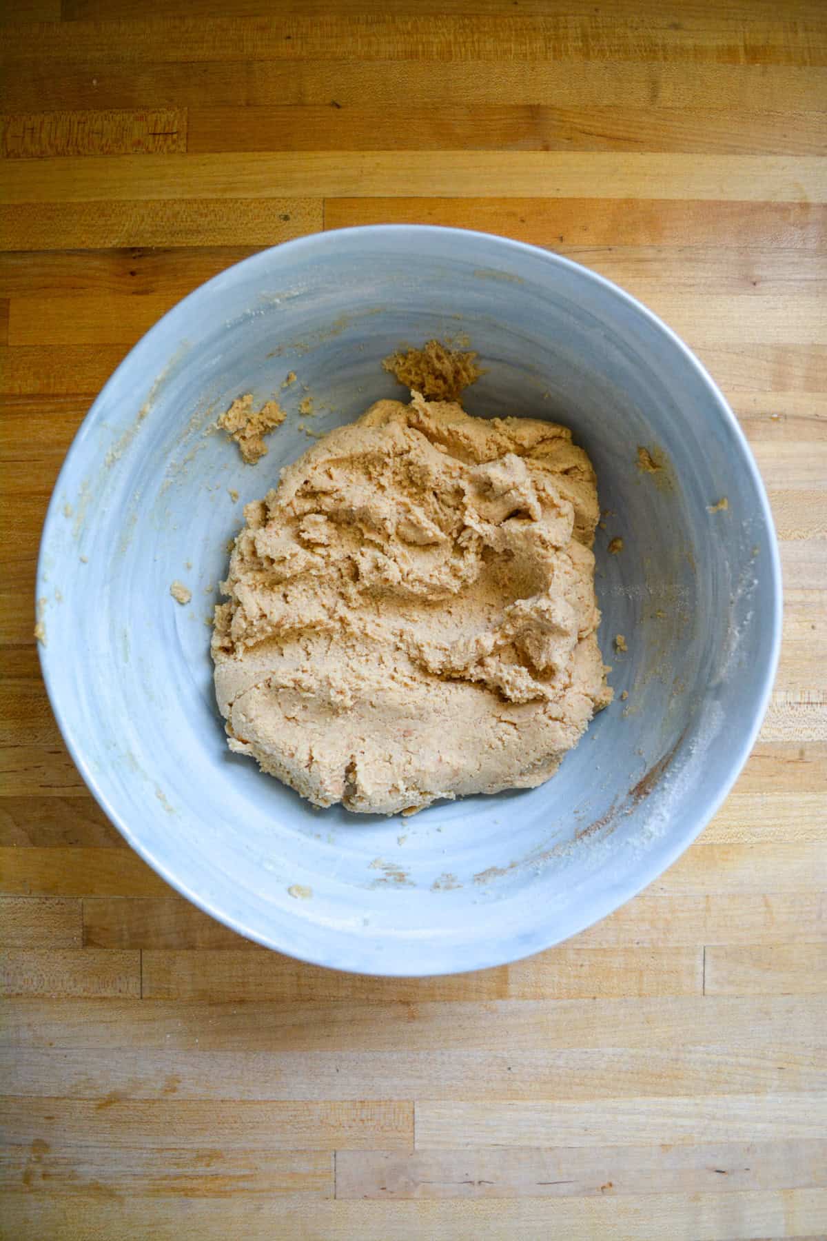 Cookie dough in a large mixing bowl.