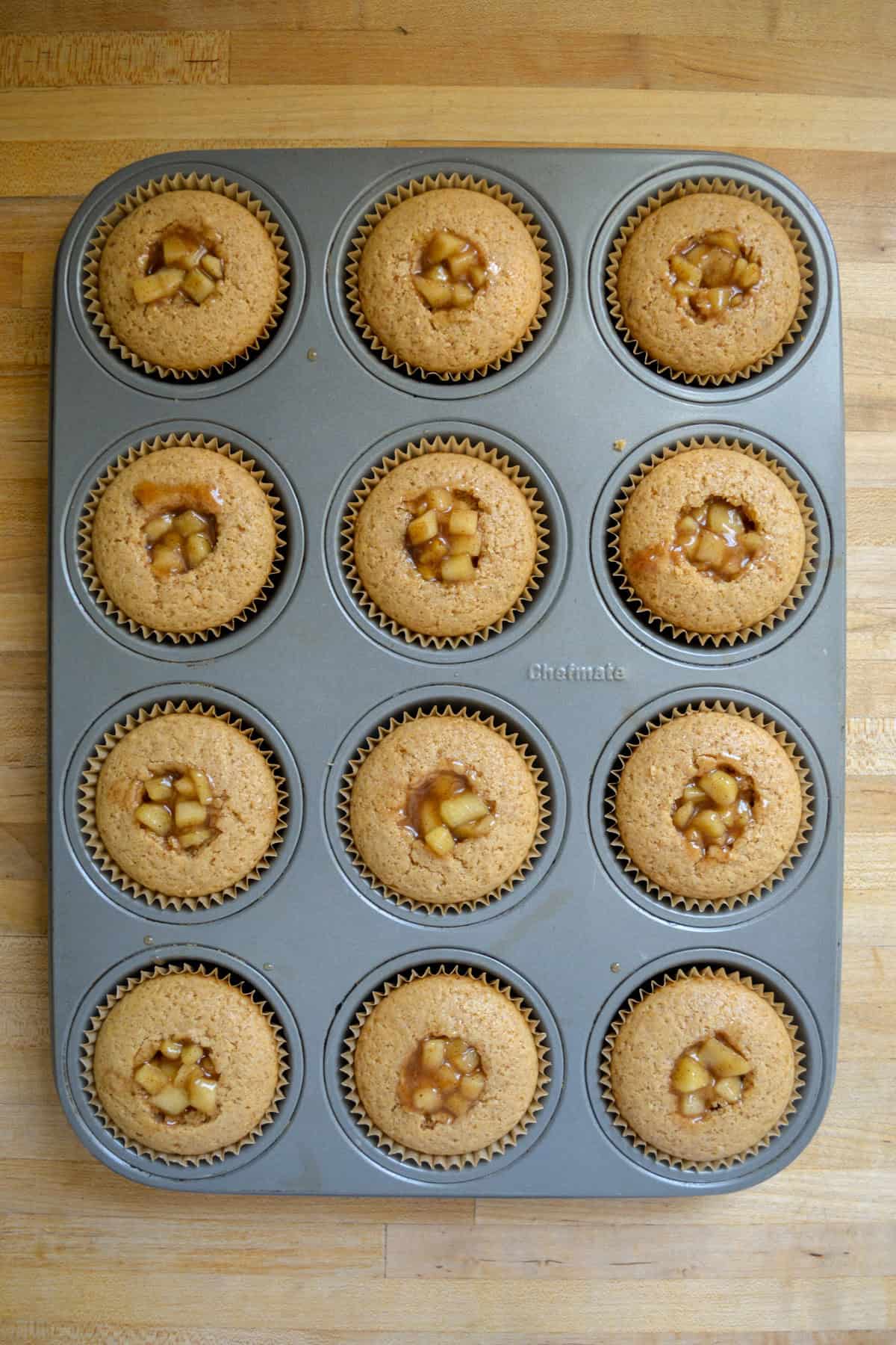 Cupcakes filled with apple pie filling.
