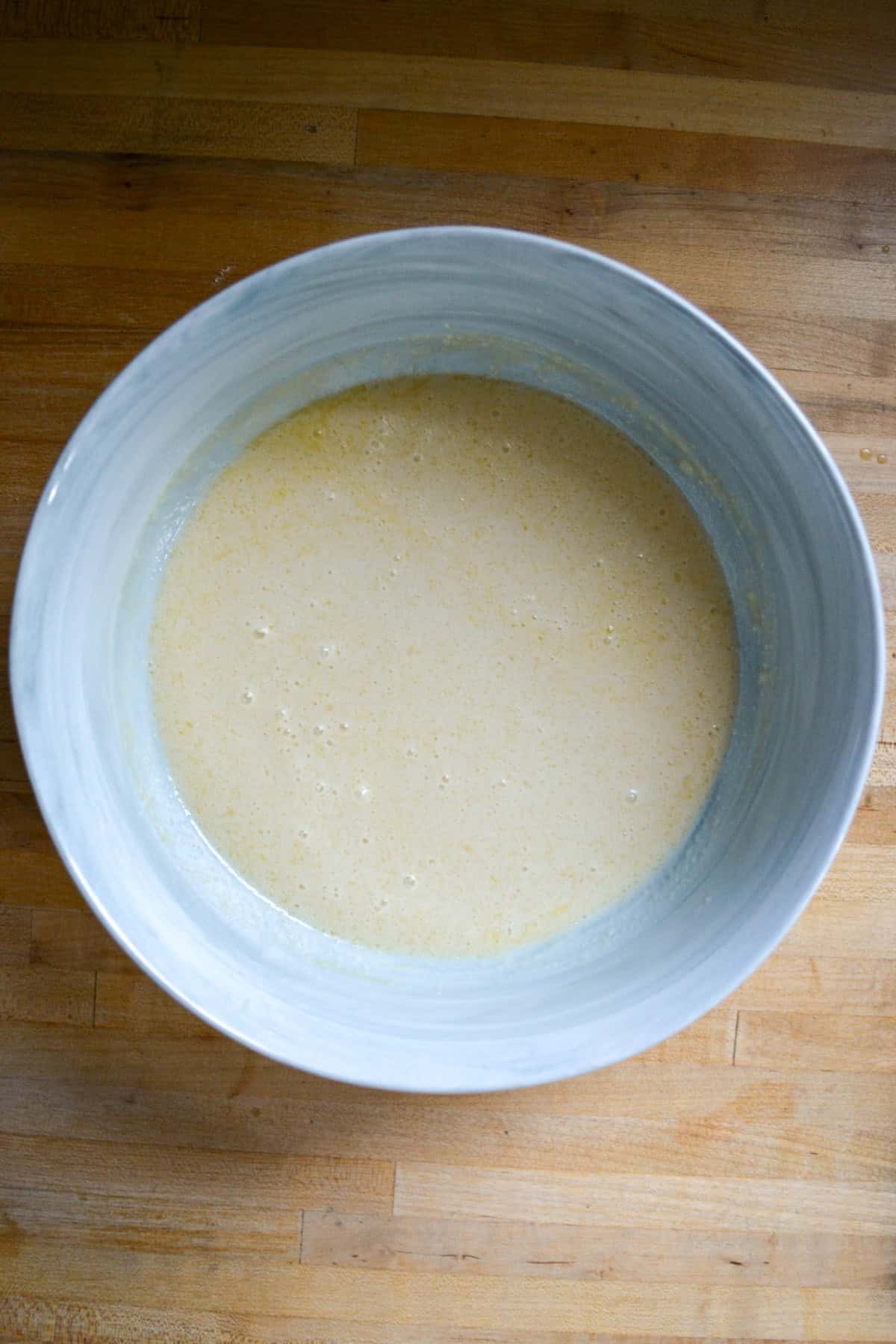 Liquid ingredients in a large mixing bowl.