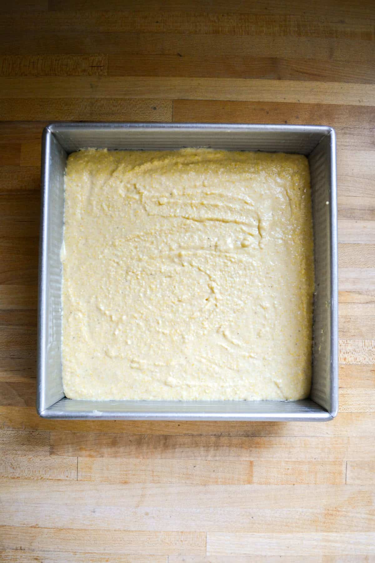 Batter in a square baking pan.