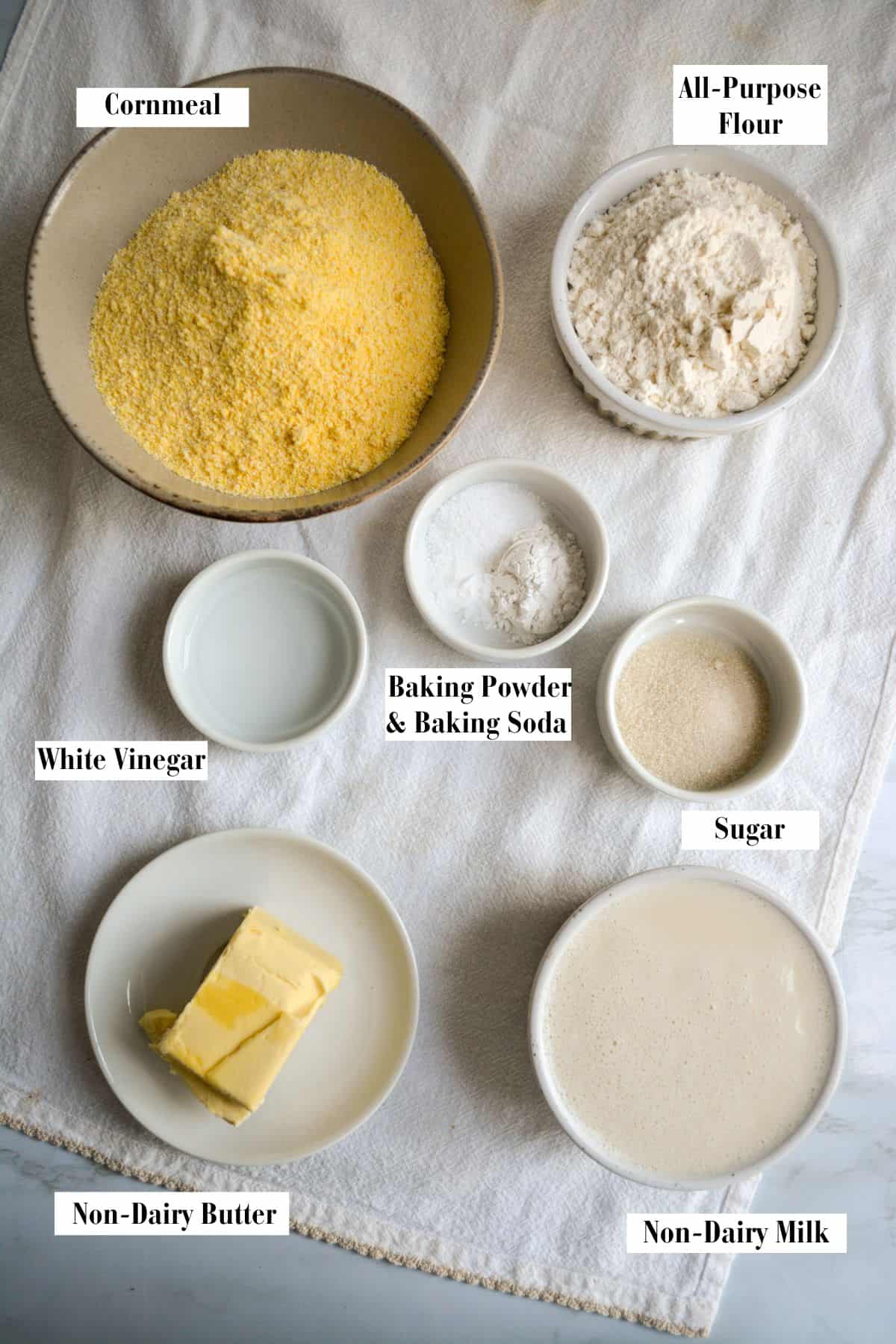 Ingredients for making this recipe in small bowls on a linen cloth.