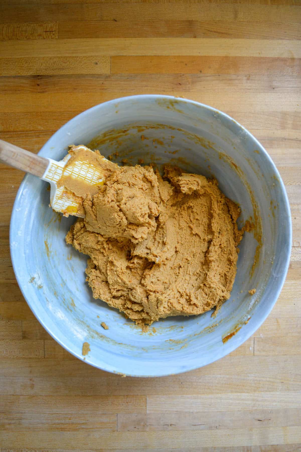 Cookie dough in a large mixing bowl.