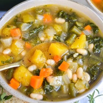 Acorn Squash Soup with White Beans in a bowl.