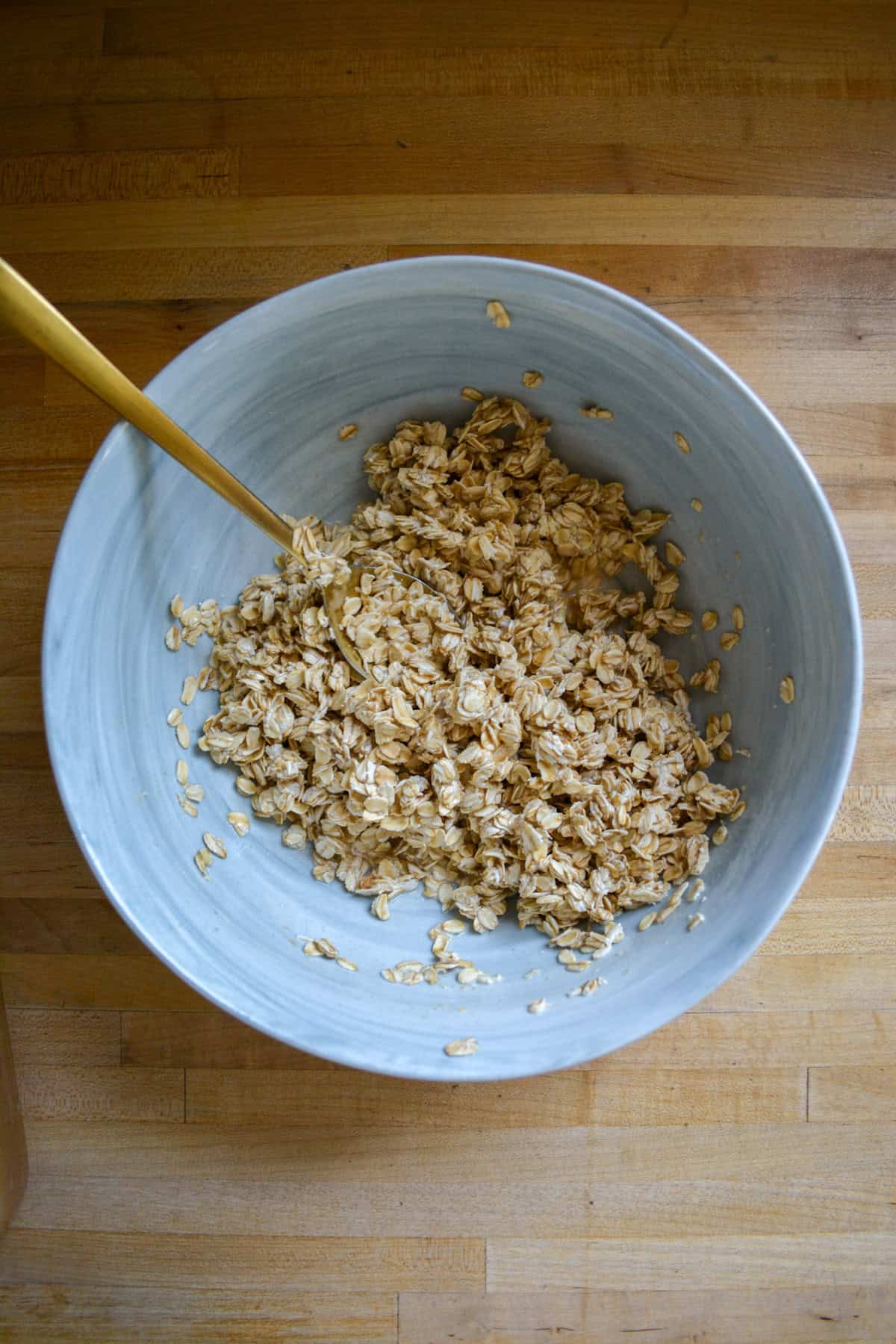 Oatmeal soaking in milk in a large mixing bowl.