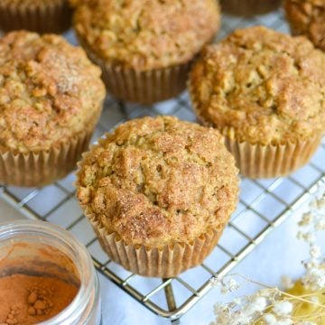 Applesauce Oatmeal Muffins on a wire cooling rack.