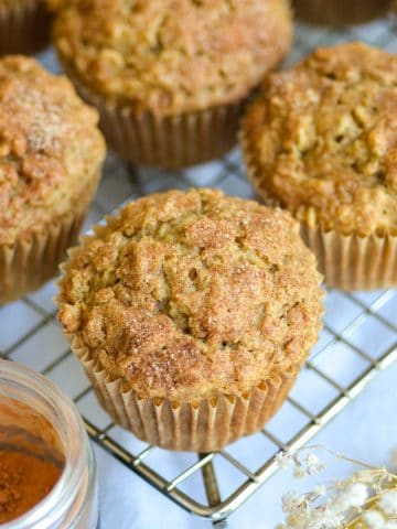 Applesauce Oatmeal Muffins on a wire cooling rack.