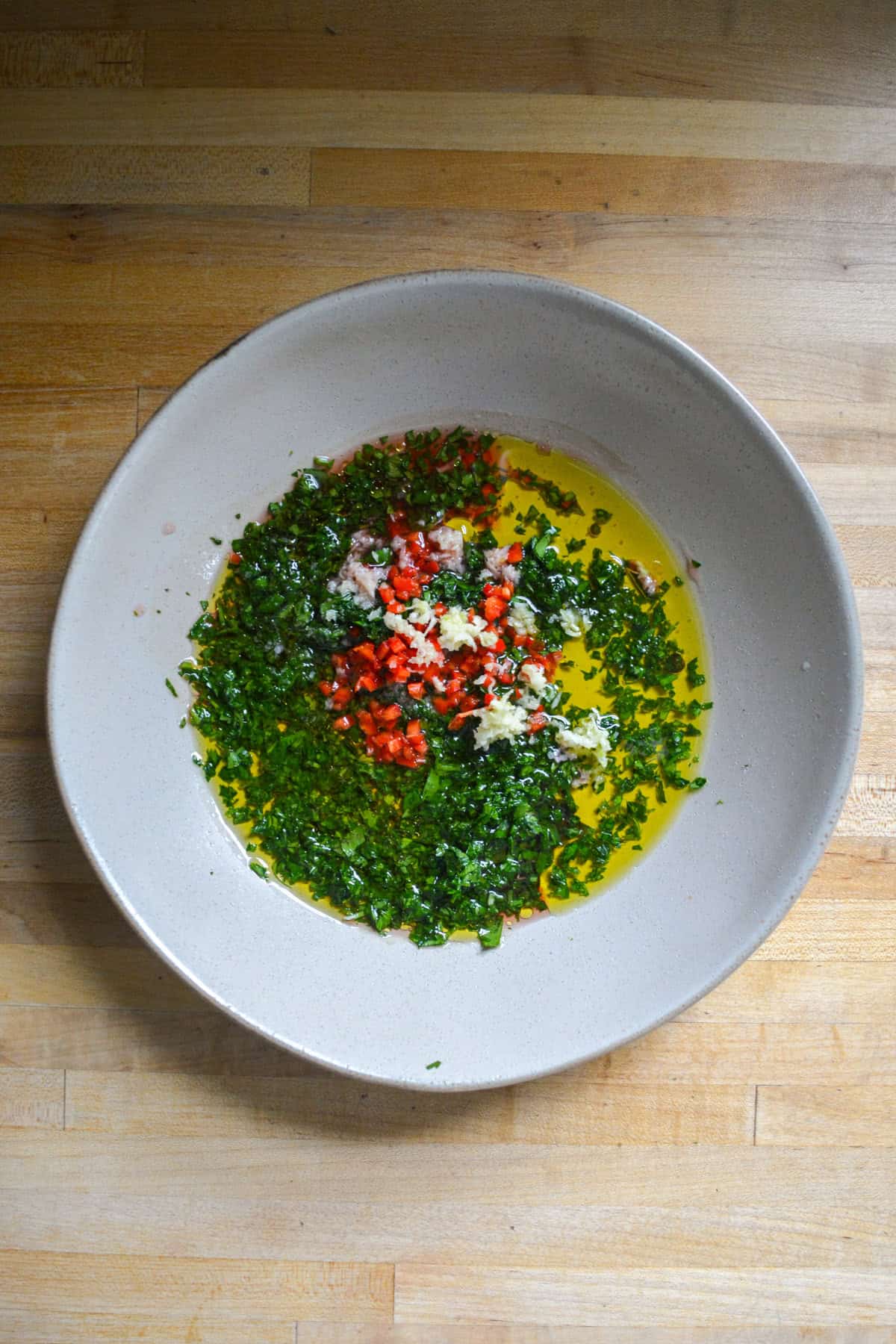 Herb vinaigrette in a bowl.