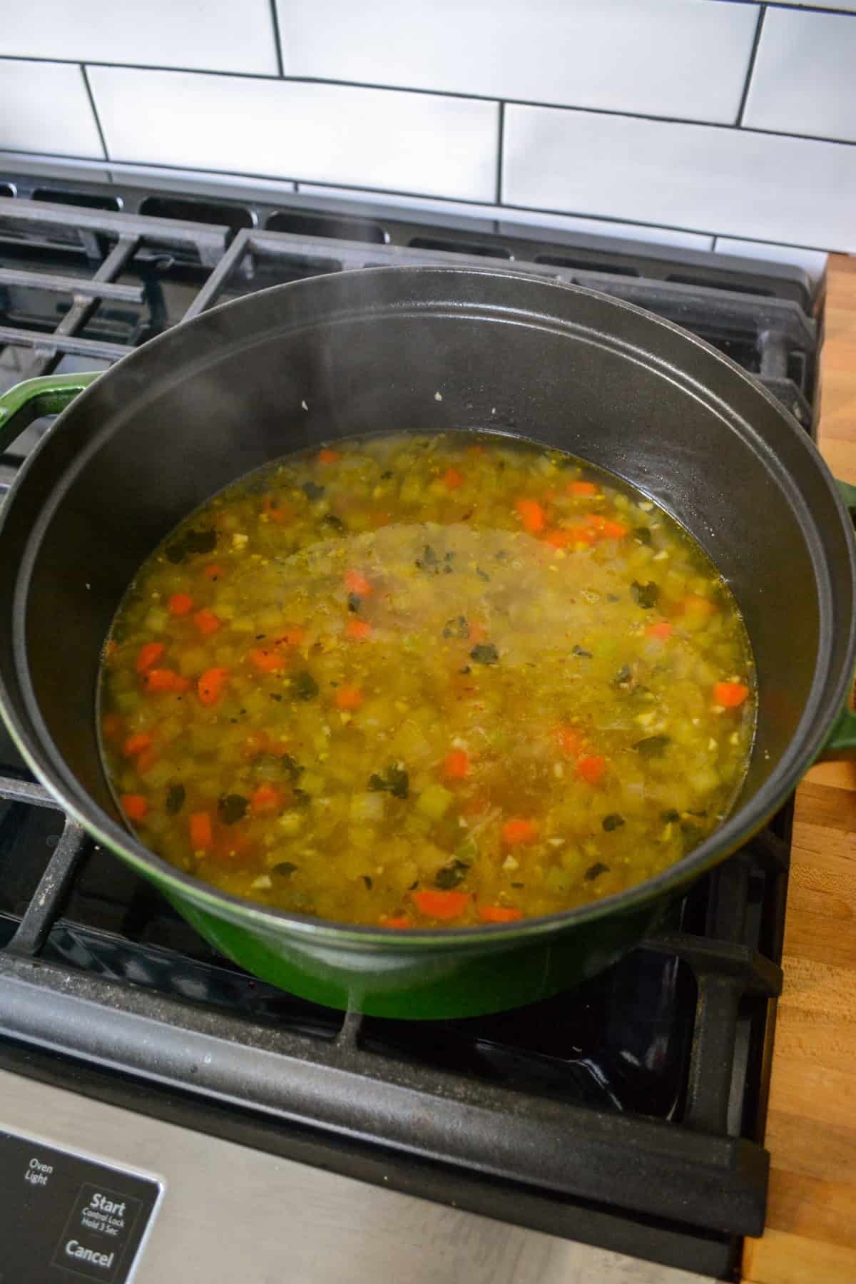 Soup simmering in a large Dutch oven.