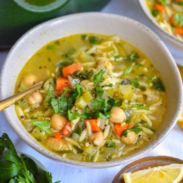 Vegan Lemon Vegetable Orzo Soup in a bowl.