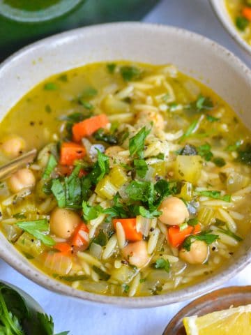 Vegan Lemon Vegetable Orzo Soup in a bowl.