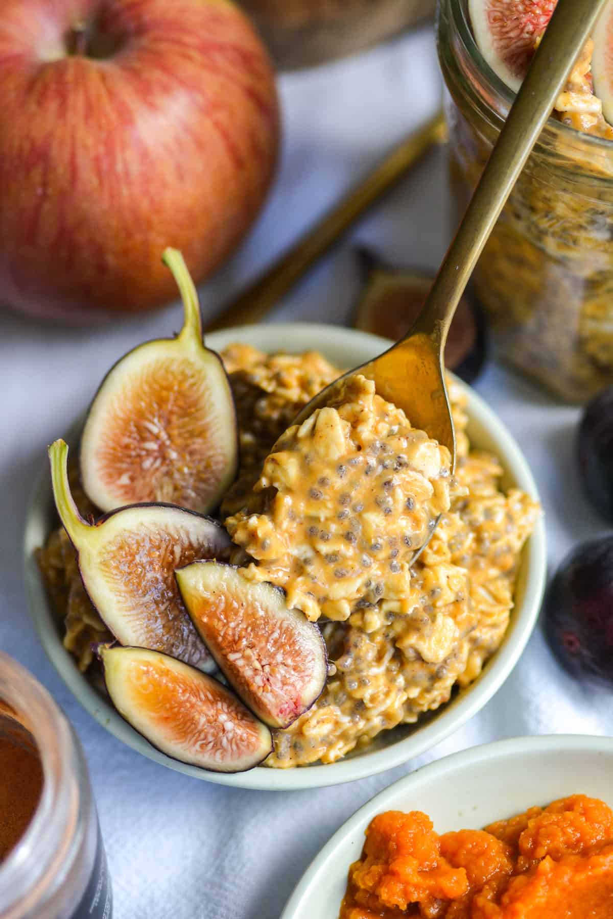 Pumpkin Pie Overnight Oats in a small bowl topped with sliced figs.