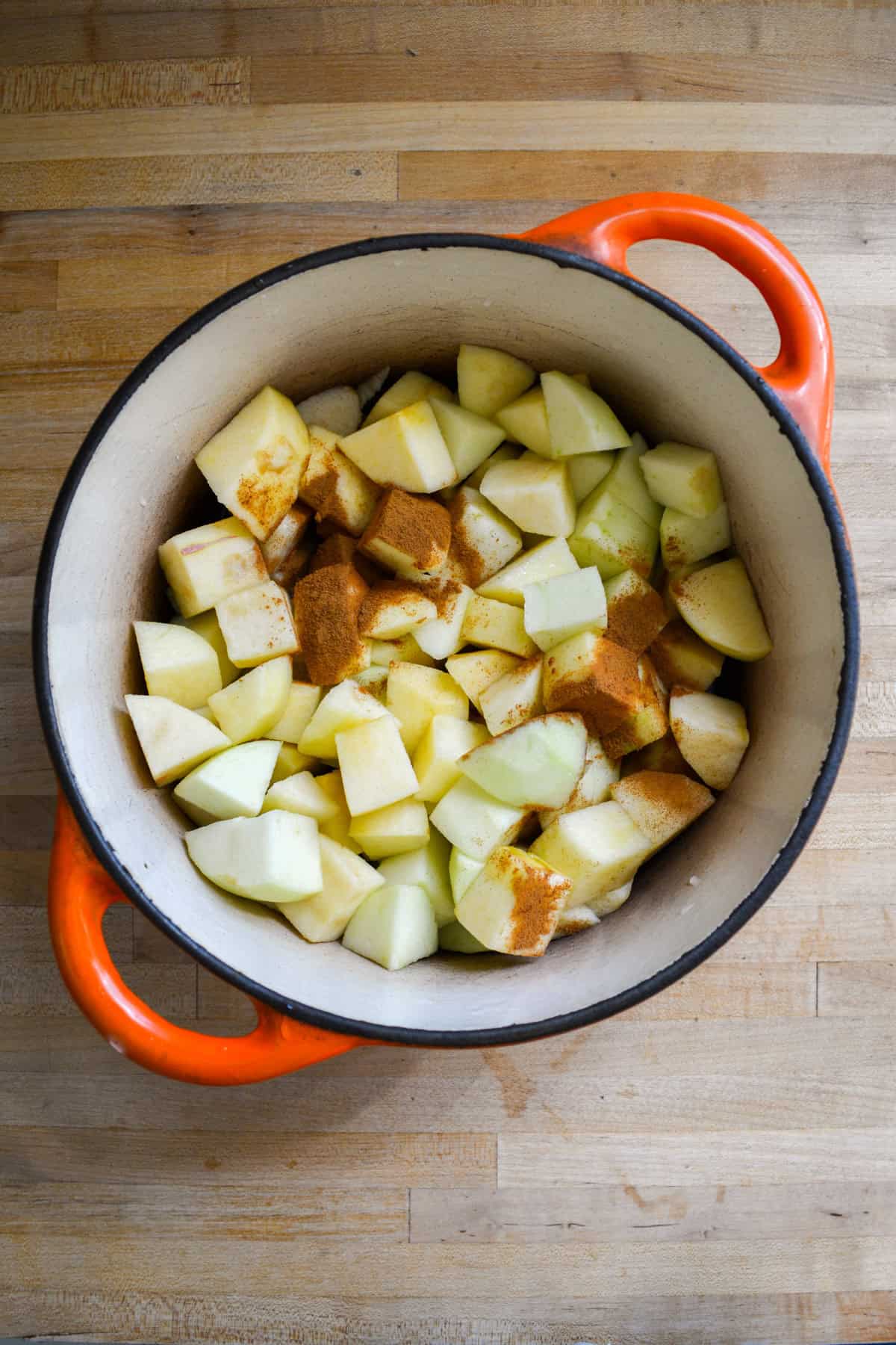 Apples and cinnamon in a dutch oven.