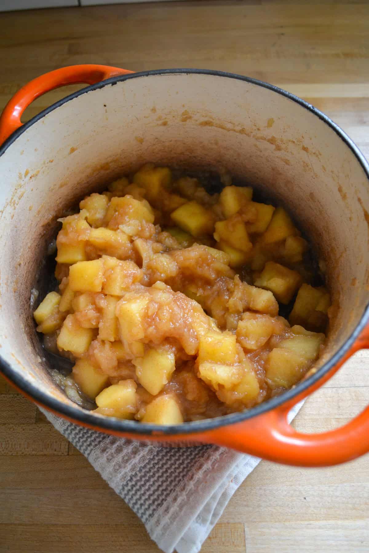 Cooked apples in a Dutch oven.