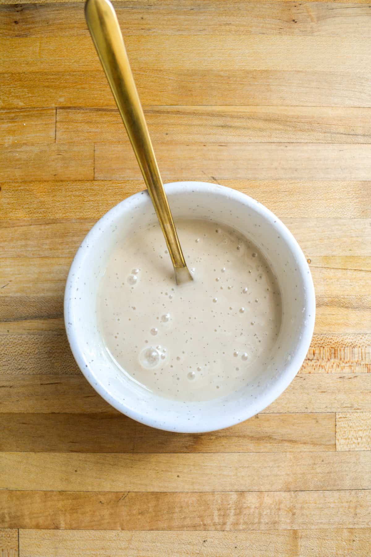 Vanilla glaze in a small bowl.