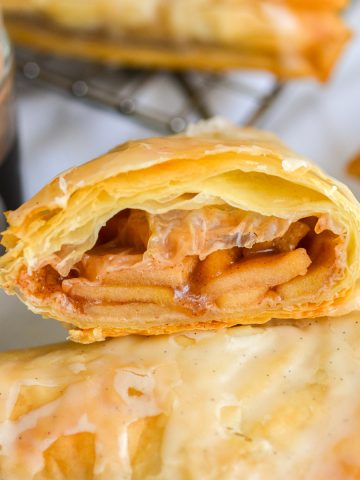 Apple Turnover with phyllo dough cut in half to show the interior.