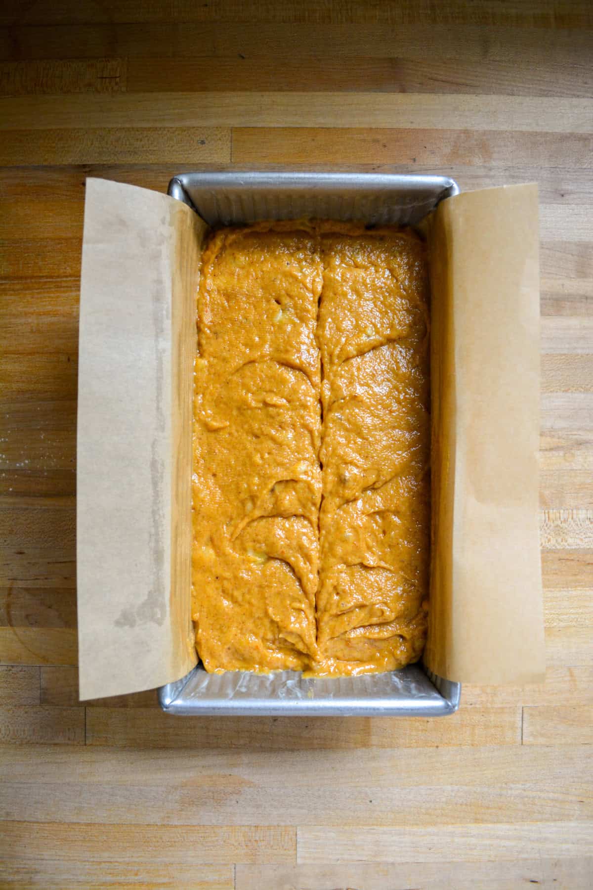 Batter in a loaf pan ready to bake.