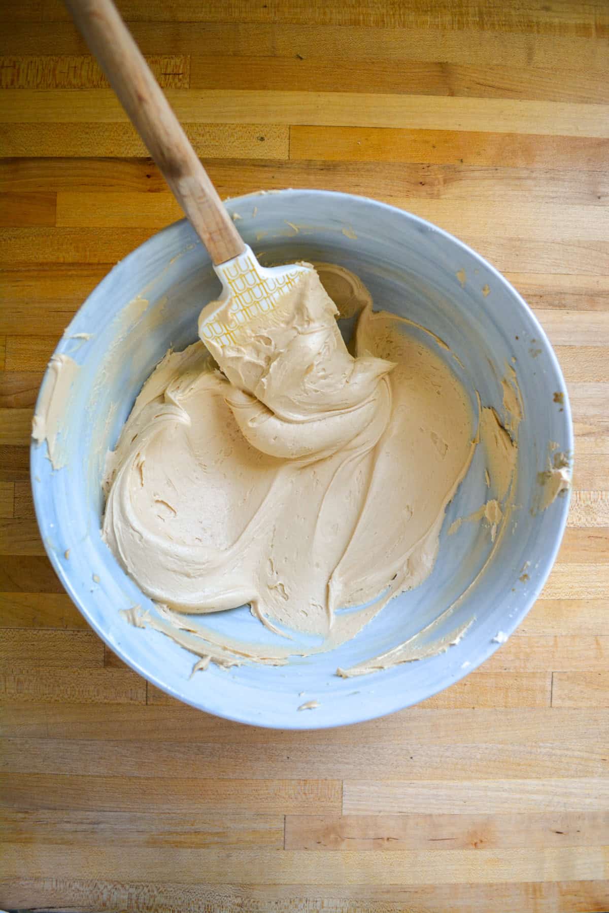 Espresso frosting in a large mixing bowl.