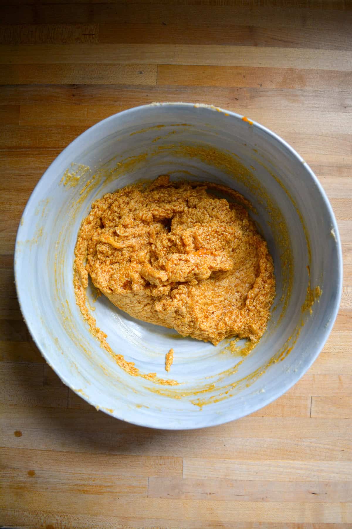 Vegan butter, brown sugar and pumpkin puree creamed together in a large mixing bowl.