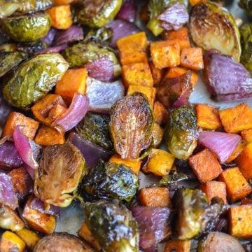Roasted Brussels Sprouts and Sweet Potatoes on a sheetpan.