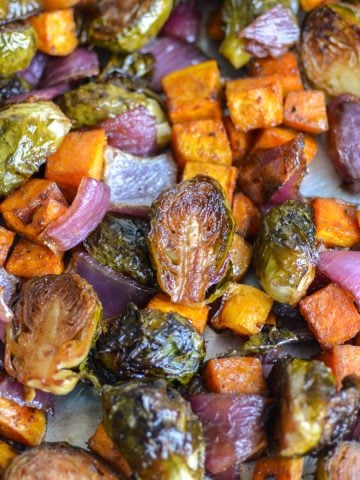 Roasted Brussels Sprouts and Sweet Potatoes on a sheetpan.