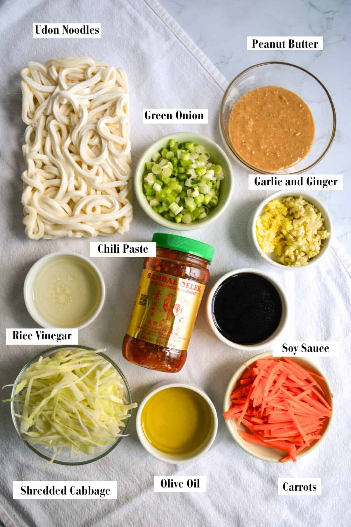 Ingredients for this recipe in small bowls on a linen cloth.