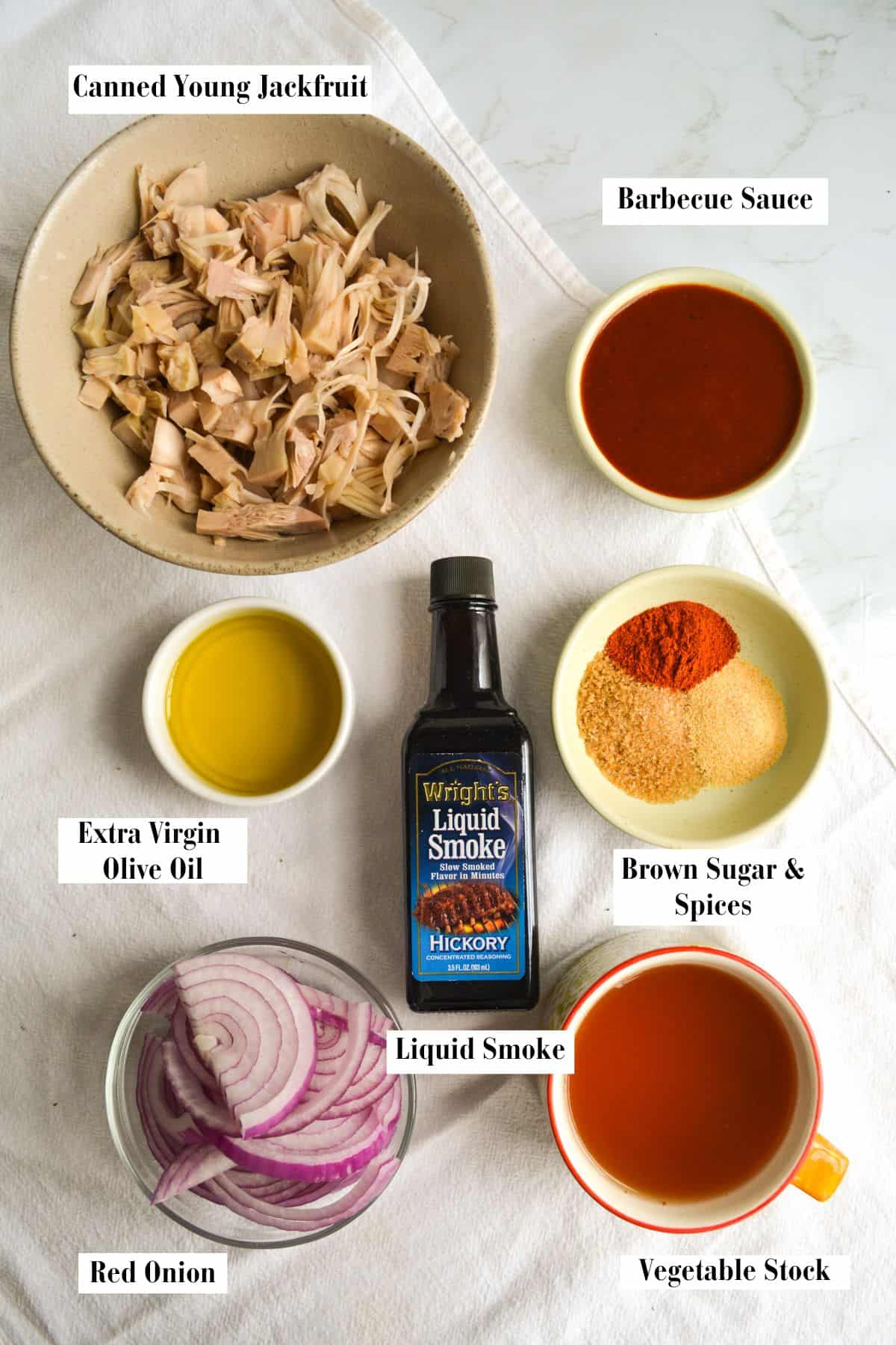 Ingredients for making this recipe in small bowls on a linen cloth.