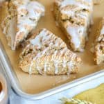Vegan Banana Scone with vanilla glaze on a baking sheet.