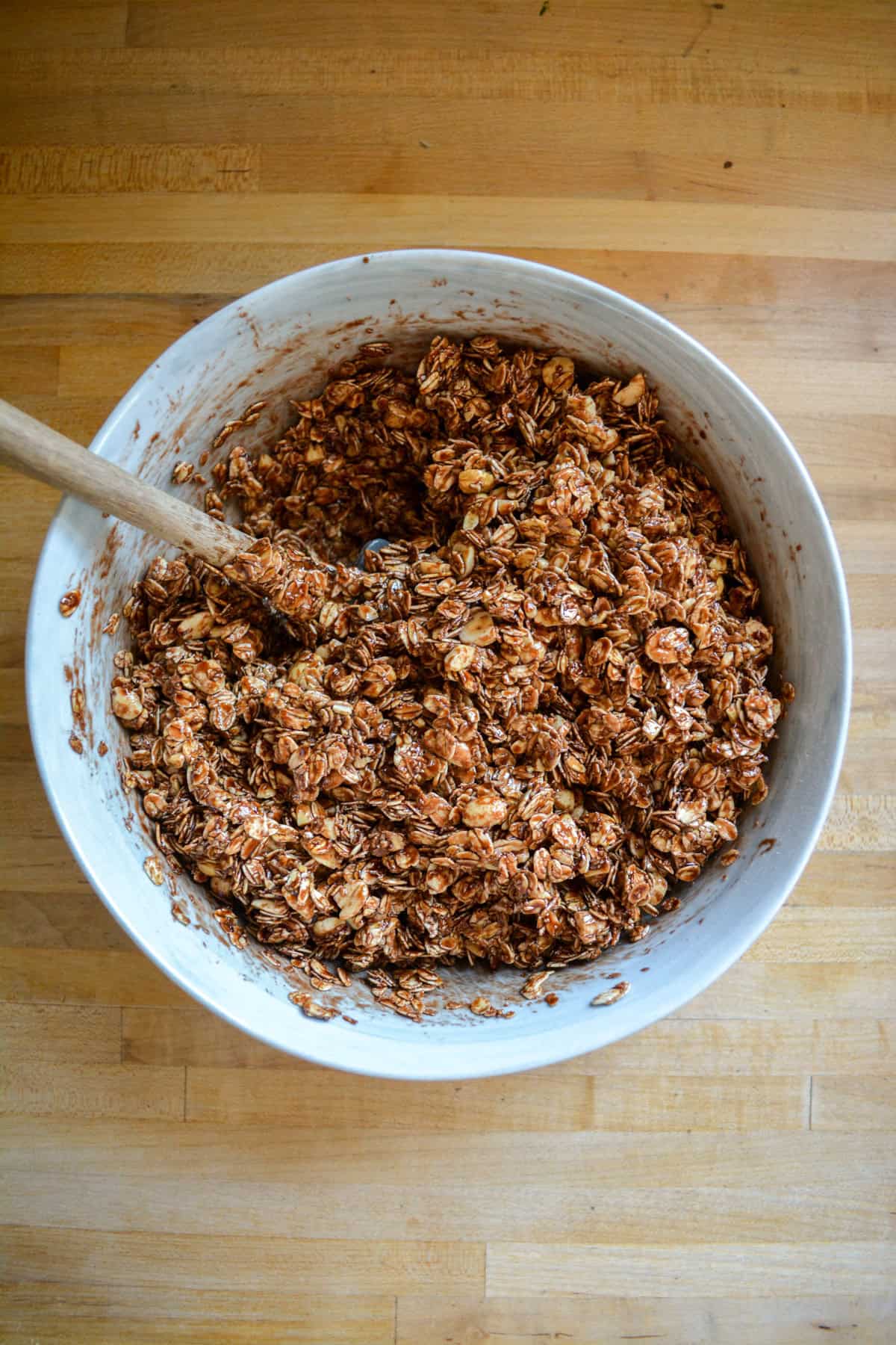 Oats mixed with the chocolate mixture in a large mixing bowl.