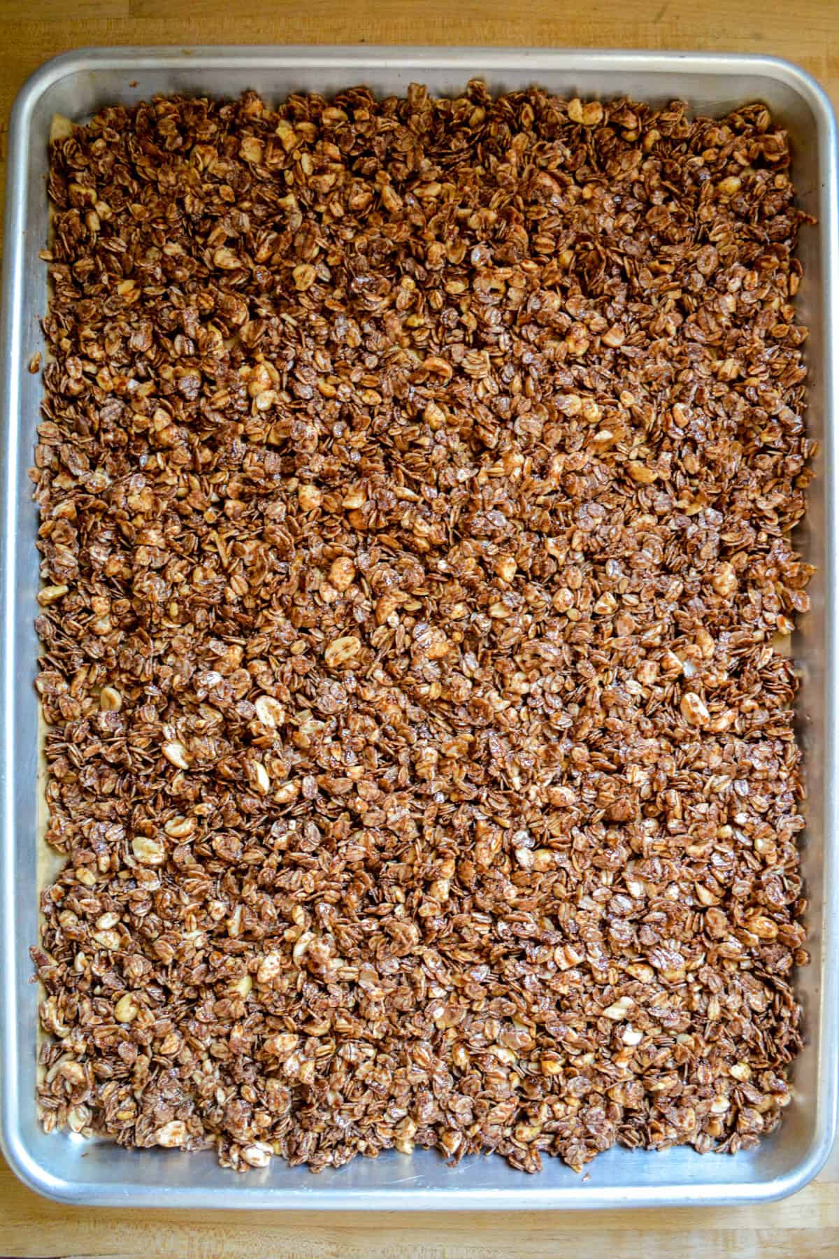 Granola on a large baking sheet.