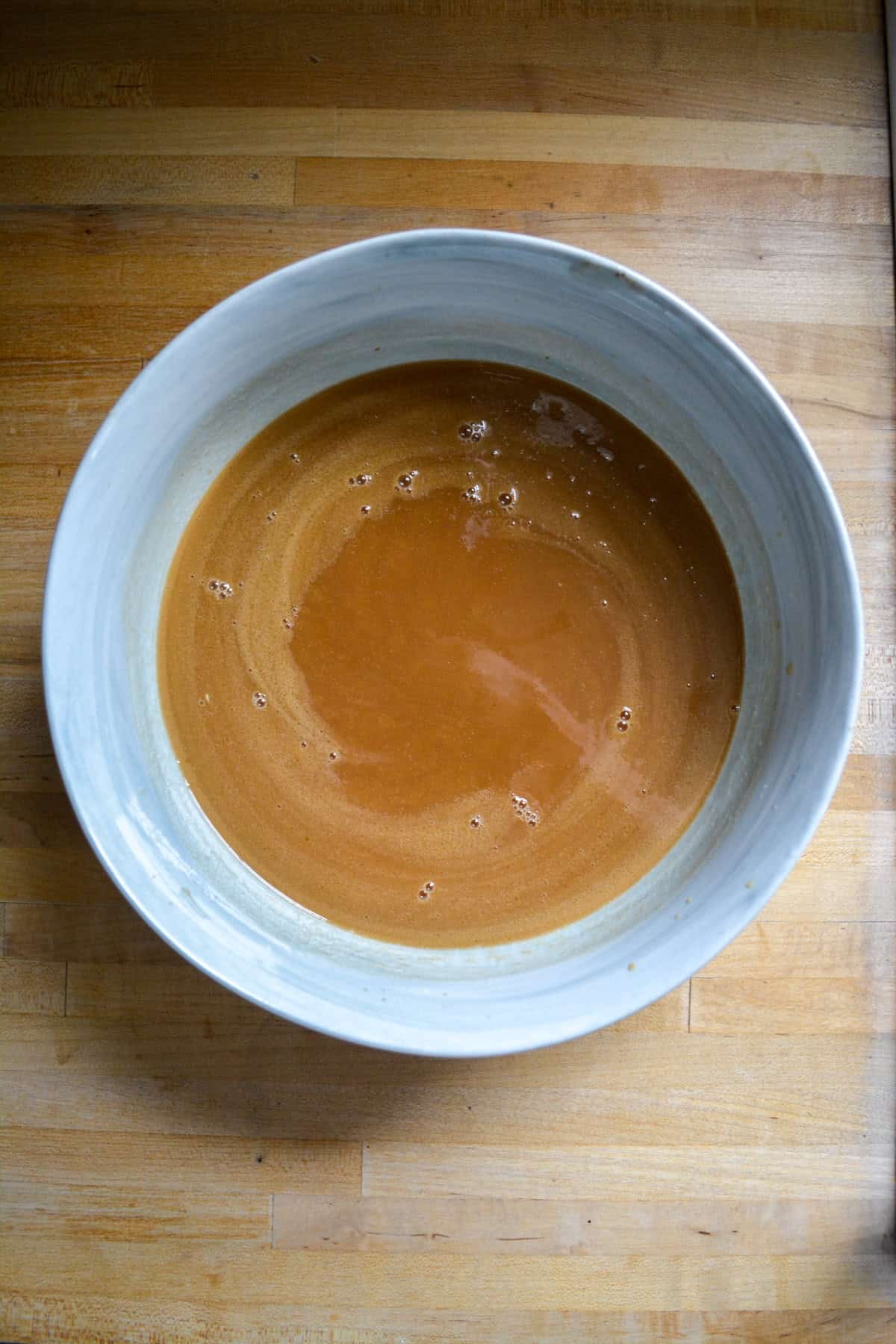 Wet ingredients for the cake batter in a large mixing bowl.