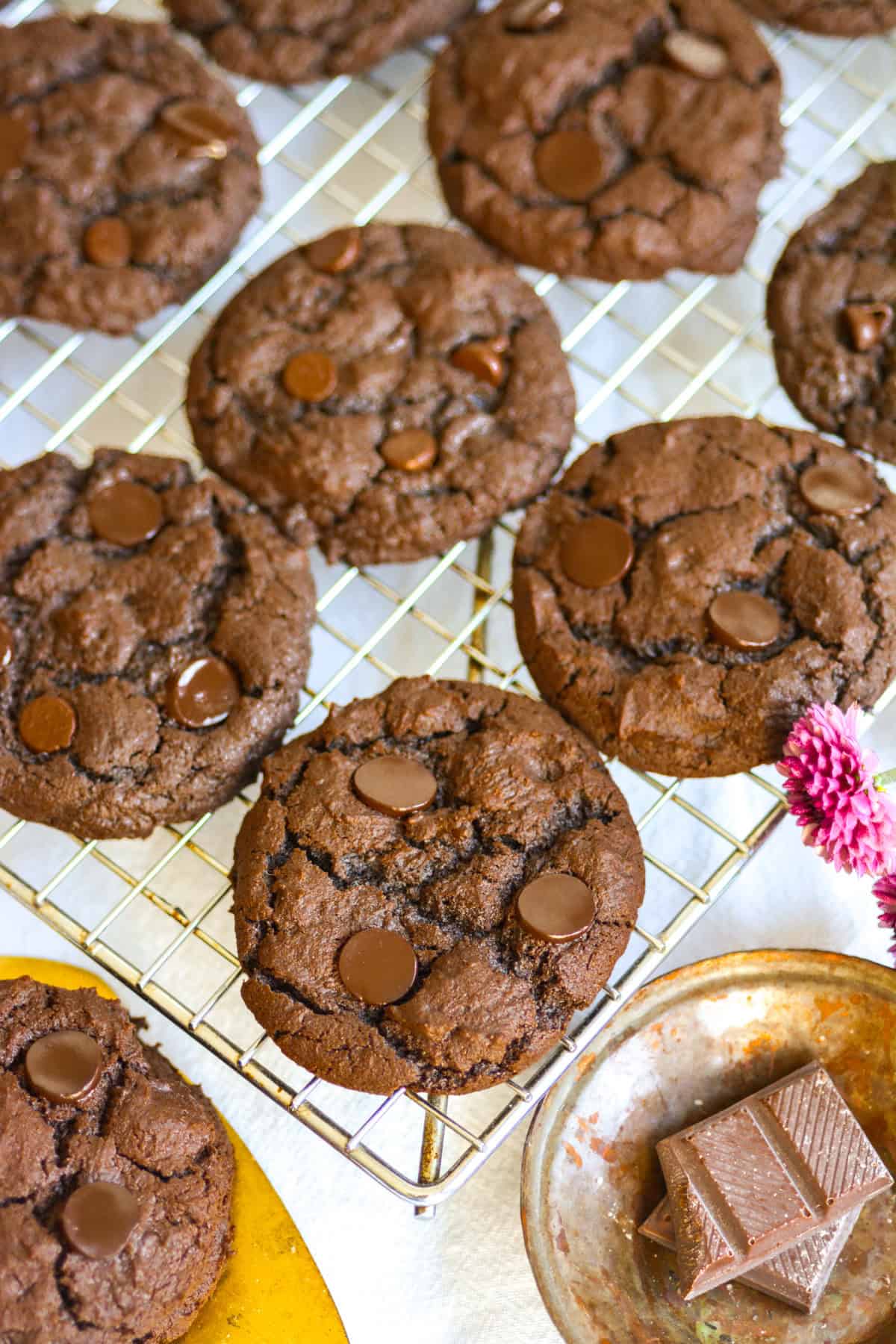 Vegan Chocolate Chocolate Chip Cookies on a wire cooling rack.