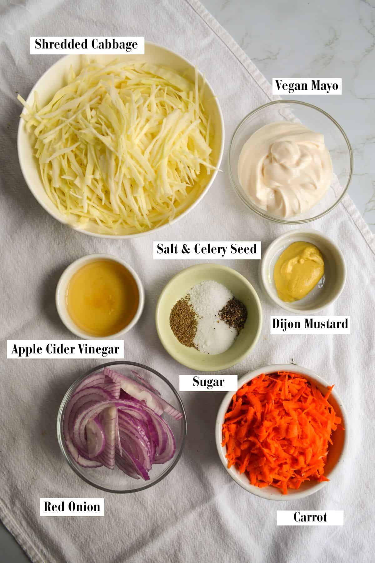 Ingredients for making this recipe in small bowls on a linen cloth.