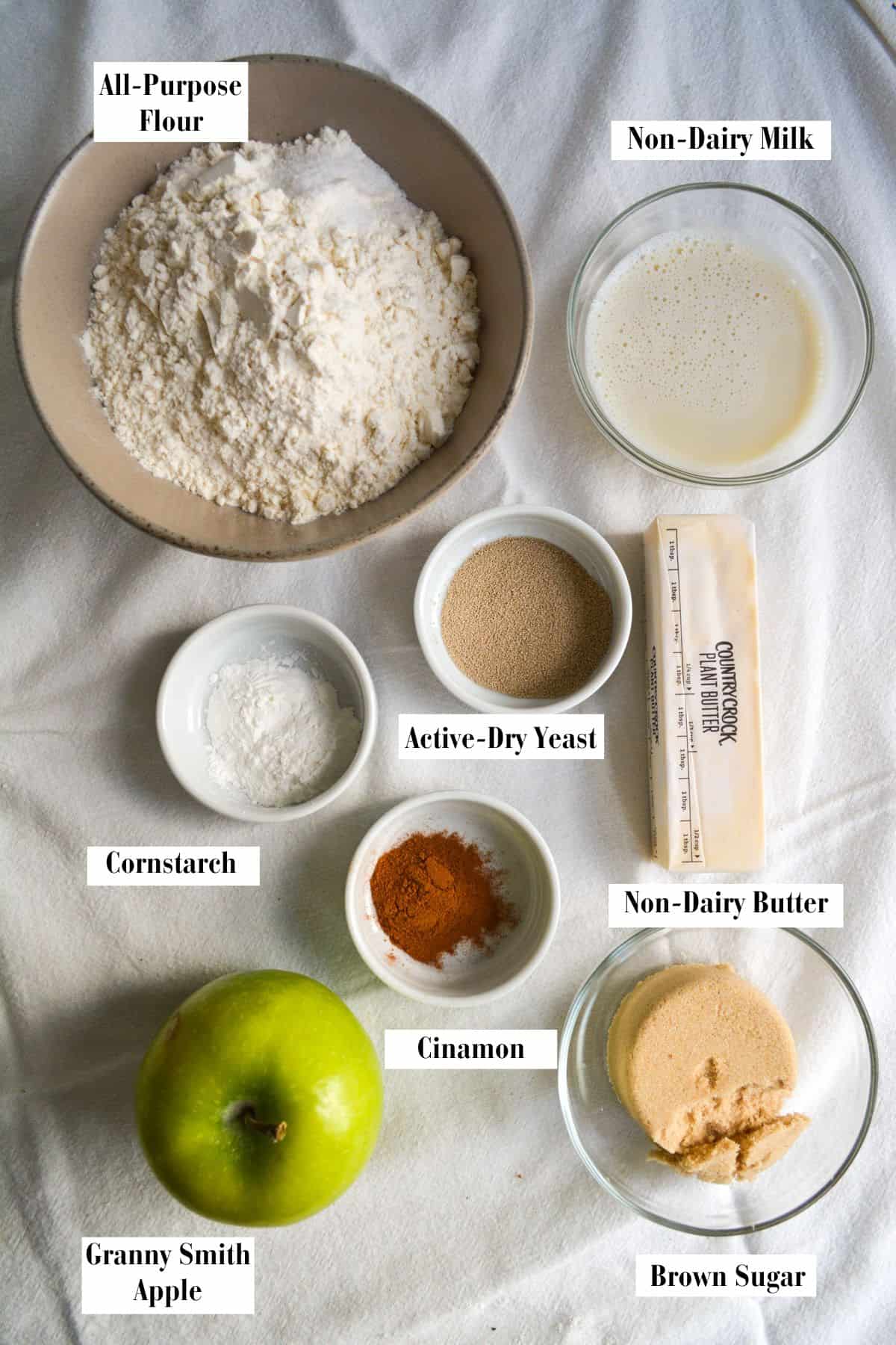 Ingredients that you need for this recipe in small bowls on a linen cloth.
