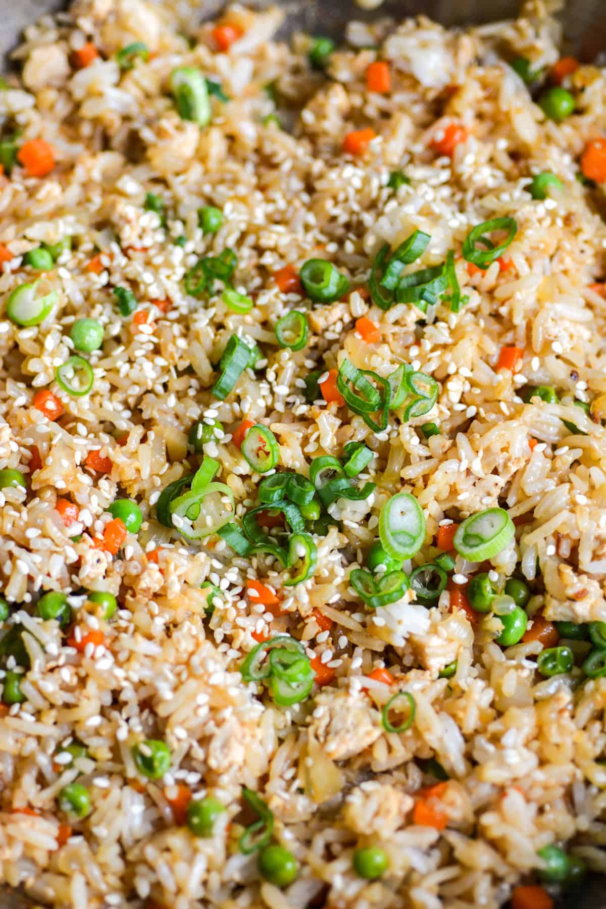 Vegan Fried Rice topped with scallions in a skillet.