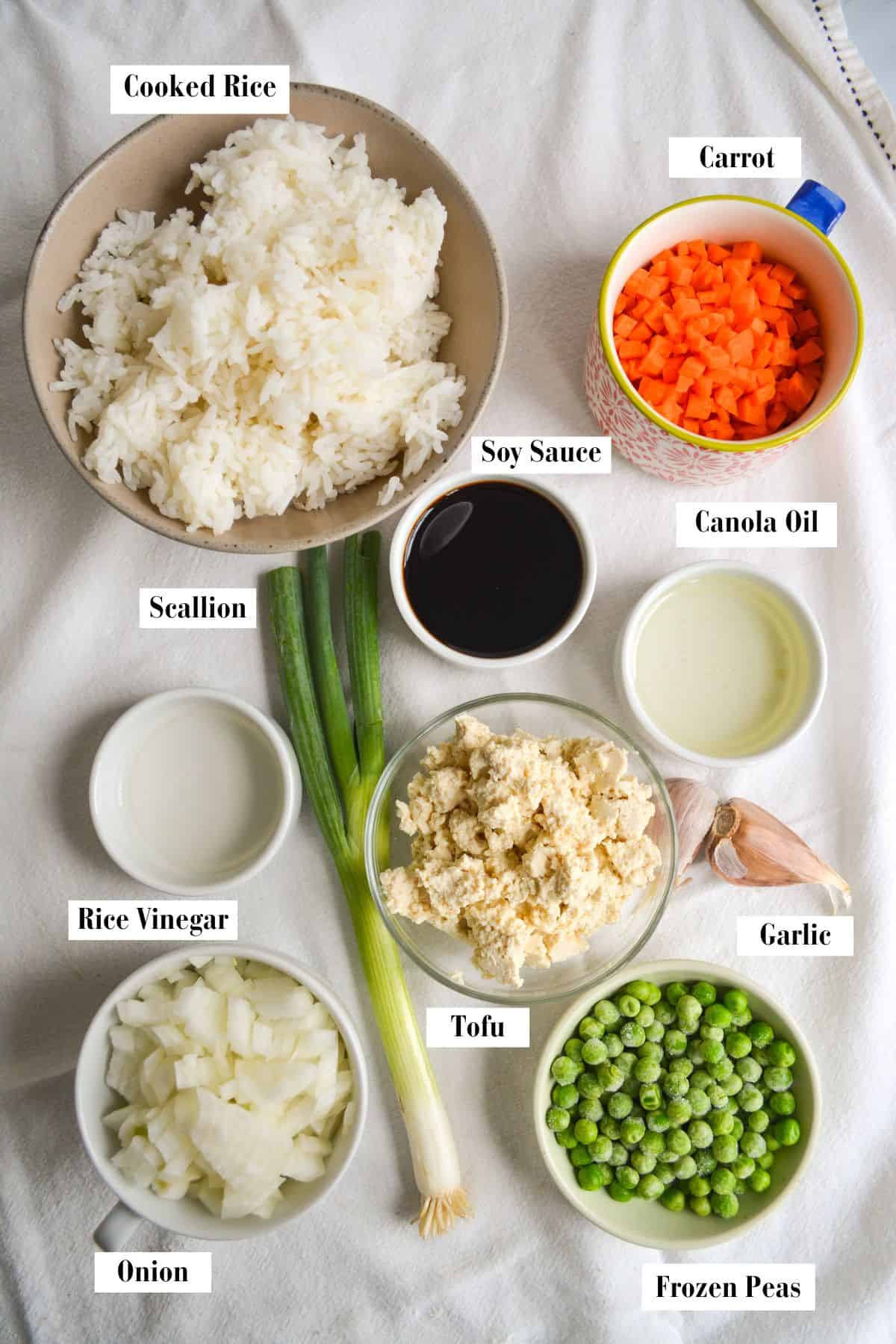 Ingredients for making this recipe in small bowls on a linen cloth.