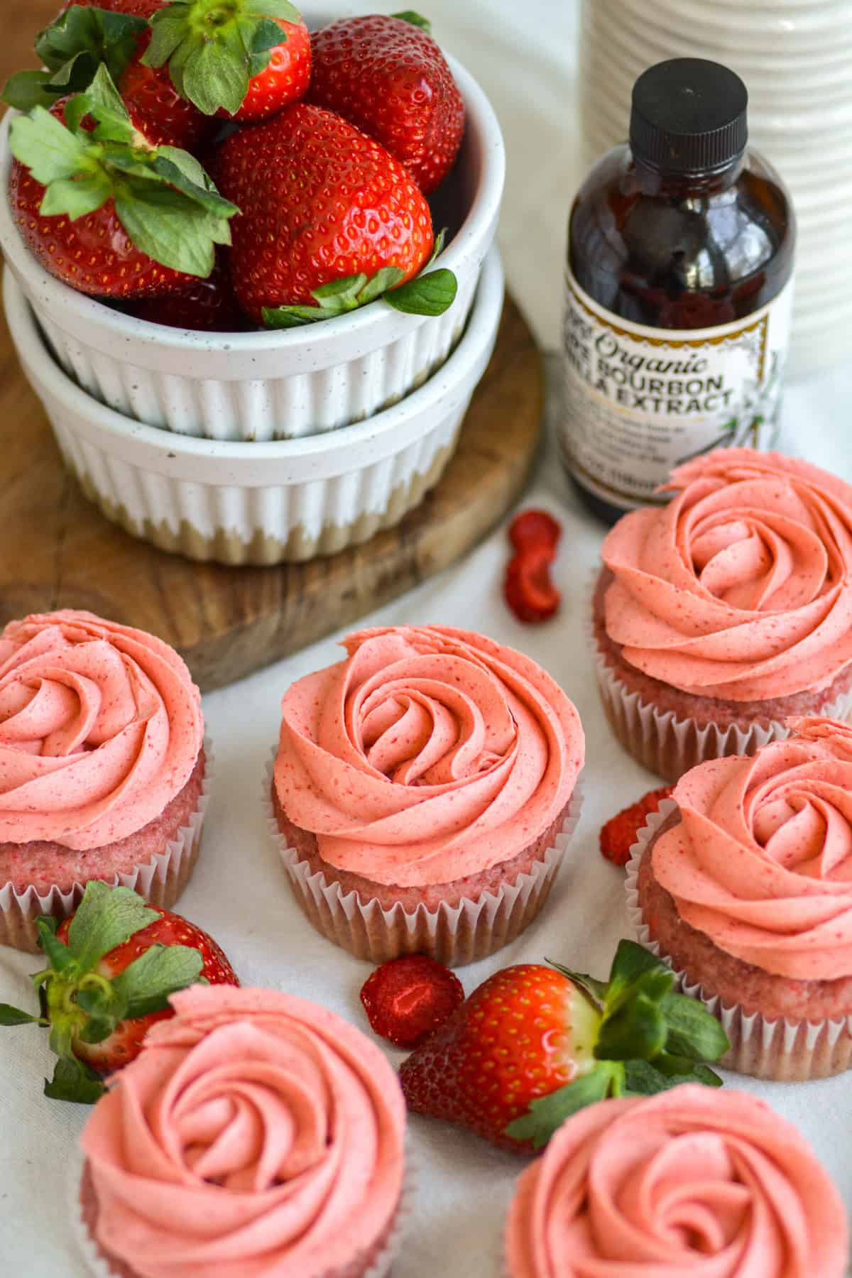 Vegan Strawberry Cupcakes with frosting piped onto them.